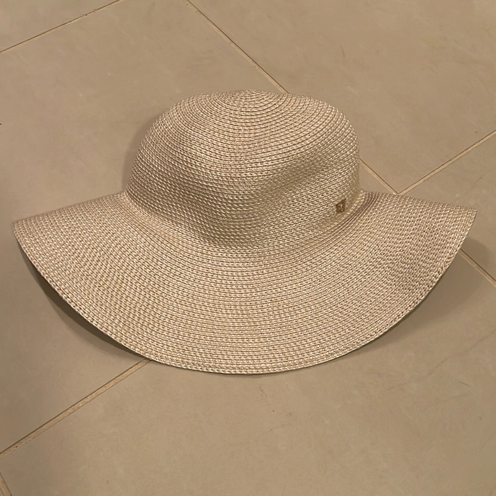 Cream straw Eric Javits hat.  One size.  Rolls up for travel and maintains shape